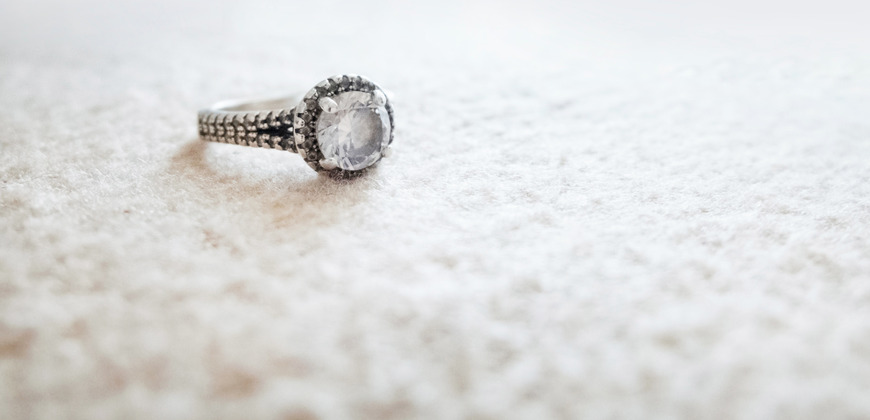 Diamond ring alone on the carpet