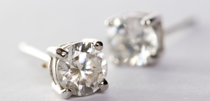 Two pairs of earrings on a white background