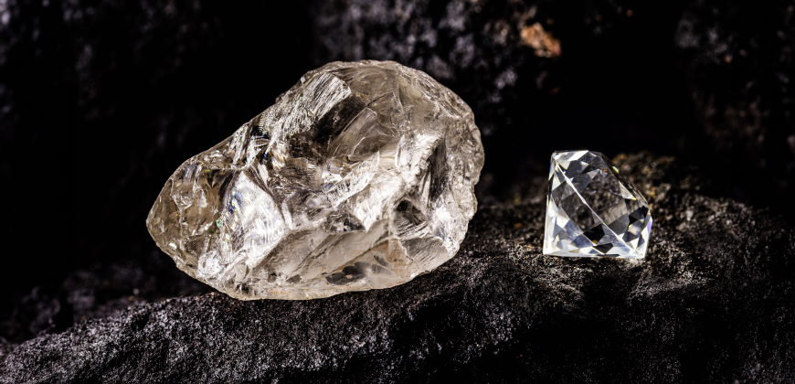 A raw diamond and cut diamond next to each other