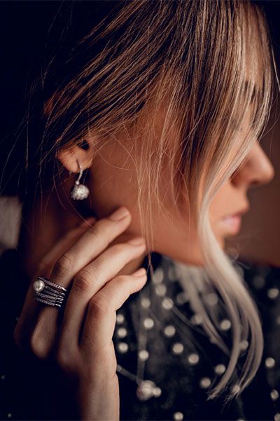 Woman wearing earring and ring