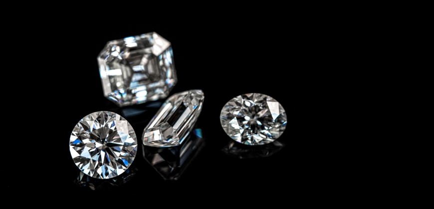 Four different diamonds on a black background