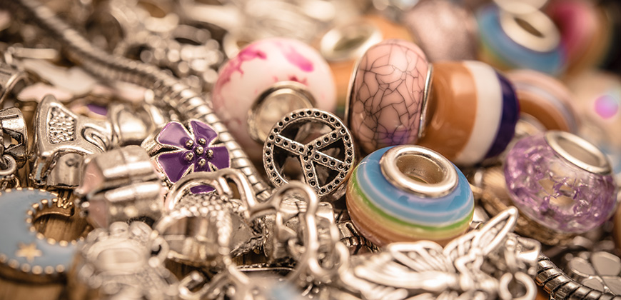 piles of 60's beads and chains stacked on top of each other