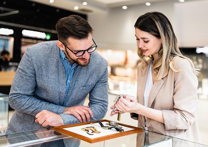 Two people looking at jewelry