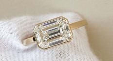 elongated diamond sitting on white wool