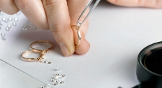 jeweler pieces together diamond ring 