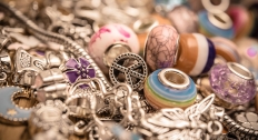 piles of 1960's style beads and chains stacked up on top of each other 